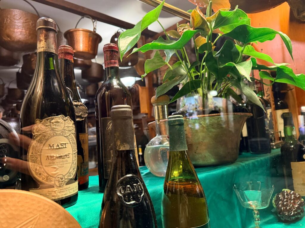 Copper pots hanging from ceiling Cantina Do Mori Venice
